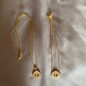 Matching necklace and bracelet with letter “F”.